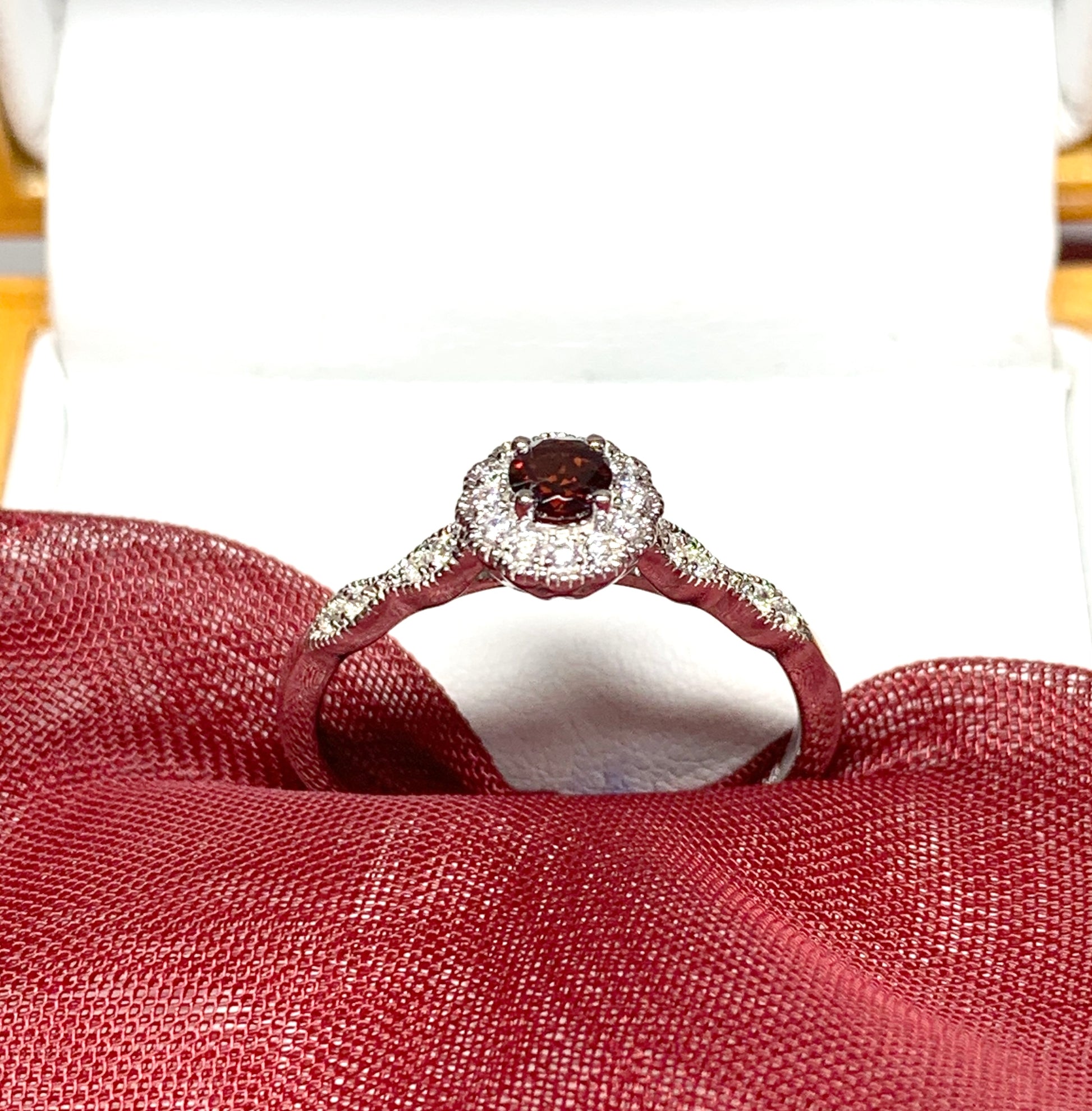 Garnet and cubic zirconia sterling silver round dress cluster ring