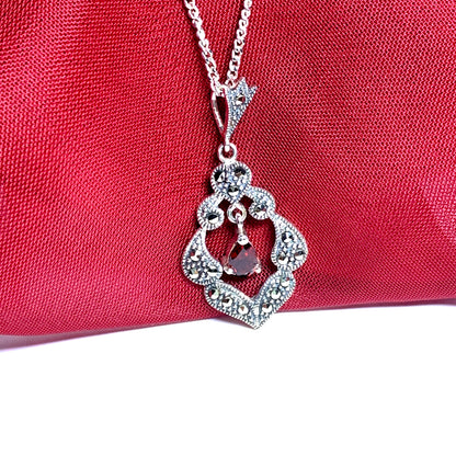 Real garnet and marcasite open pierced silver necklace