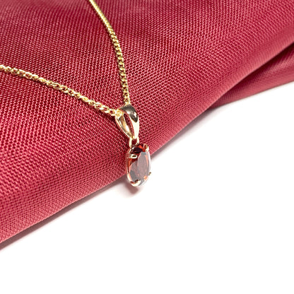 Garnet yellow gold oval four claw necklace pendent