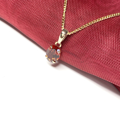 Garnet yellow gold oval four claw necklace pendent