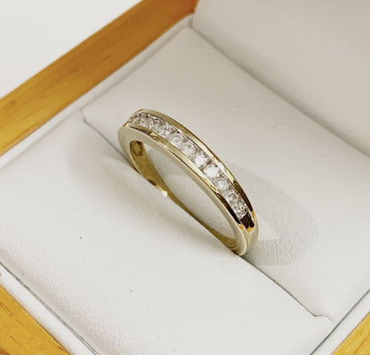 Yellow gold diamond eternity ring channel setting 25 points