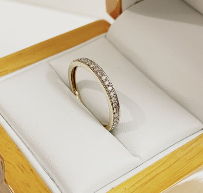 Yellow gold quarter carat diamond eternity ring grain set 25 points