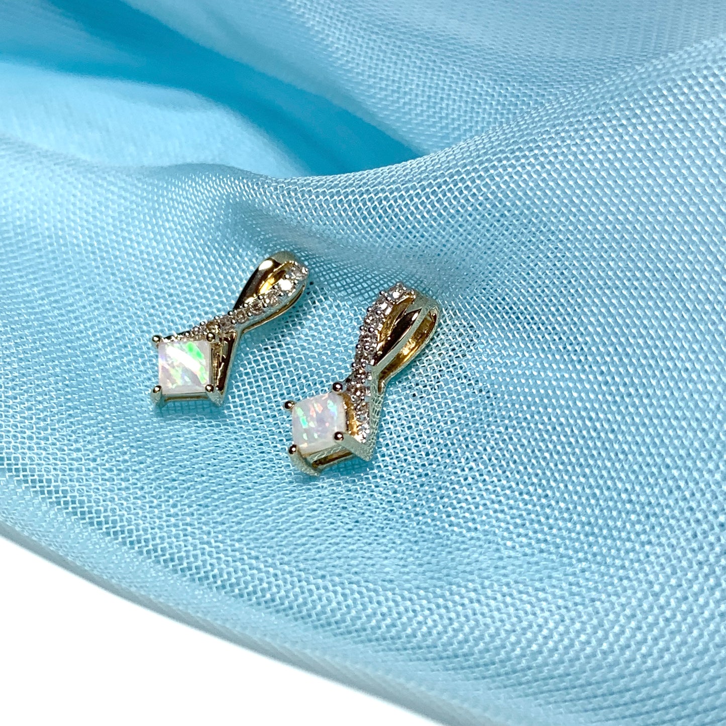 Gold opal and diamond stud earrings