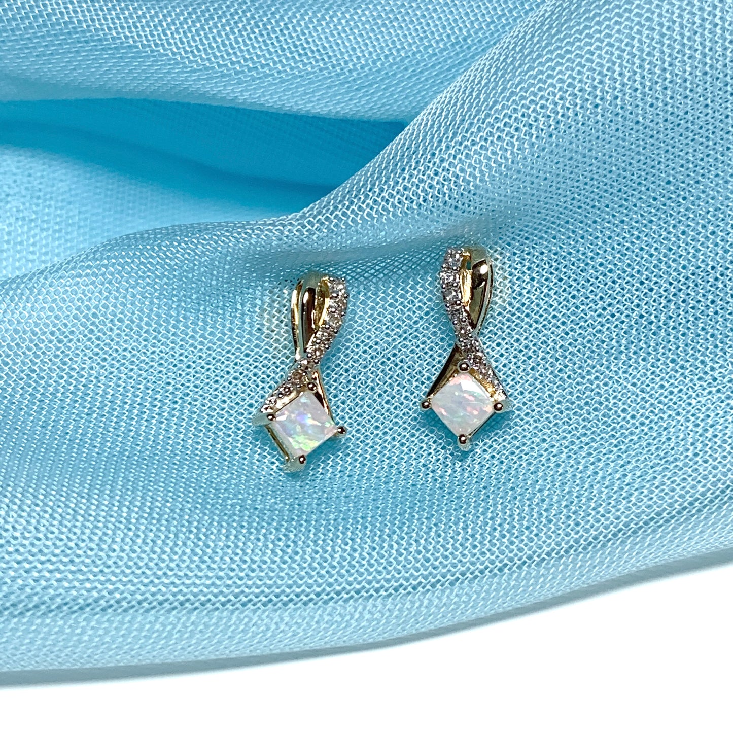 Gold opal and diamond stud earrings