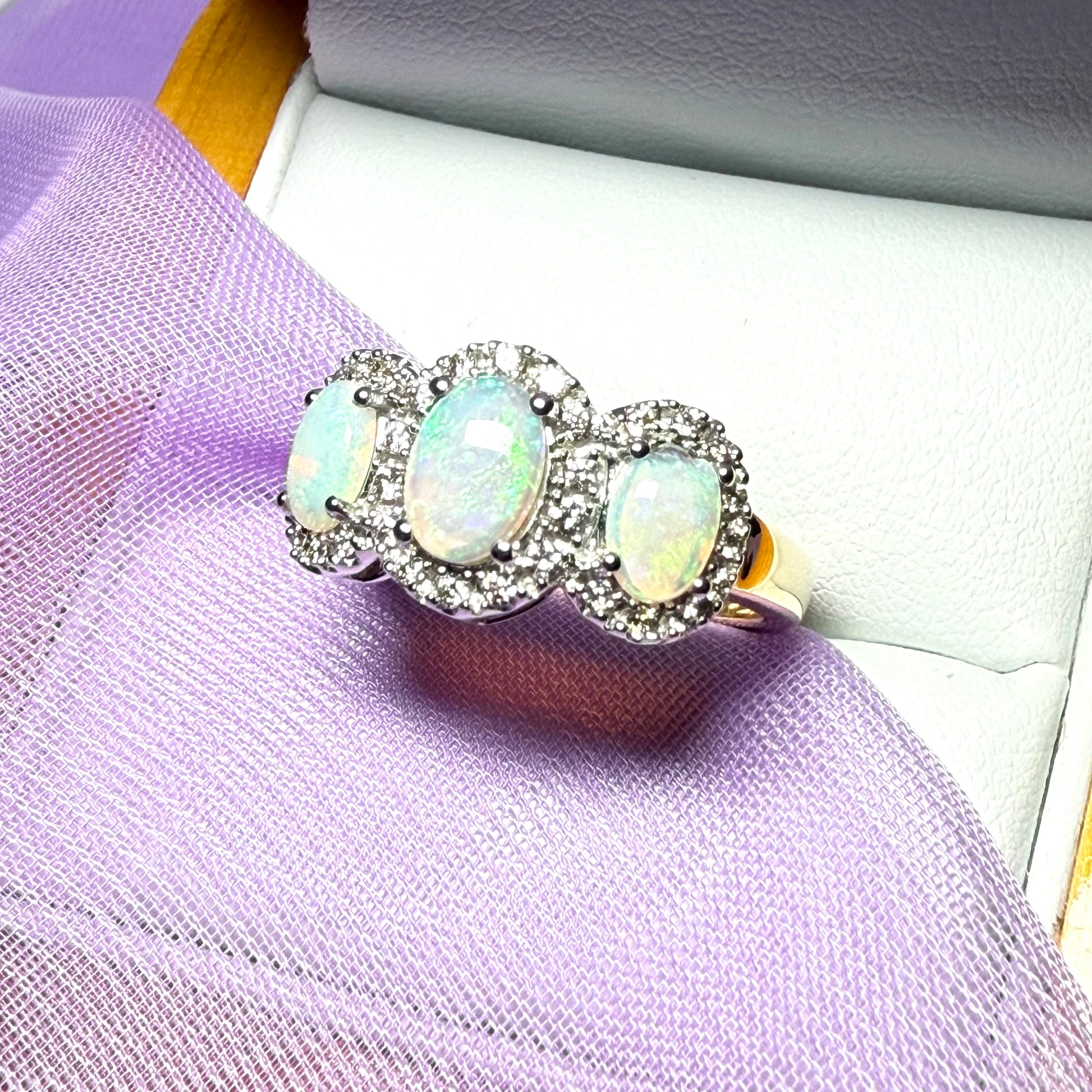 Gold oval cut three real opal and diamond trilogy cluster ring