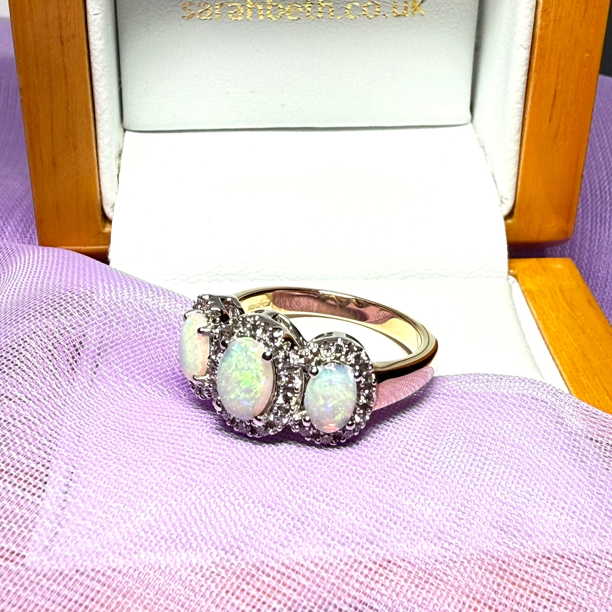 Gold oval cut three real opal and diamond trilogy cluster ring
