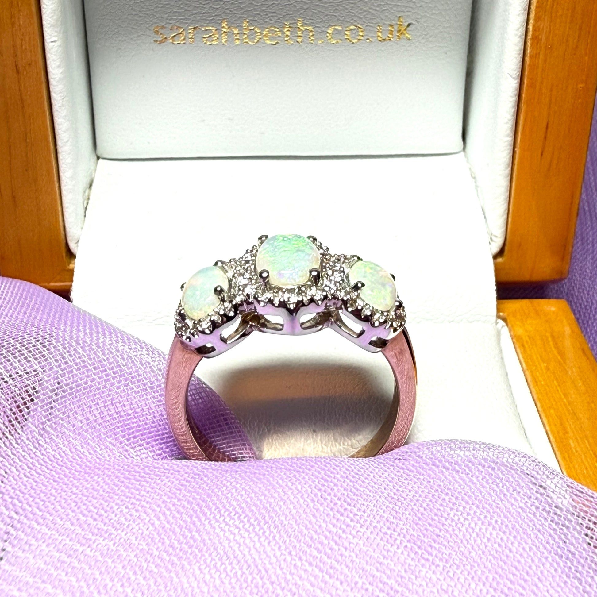 Gold oval cut three real opal and diamond trilogy cluster ring
