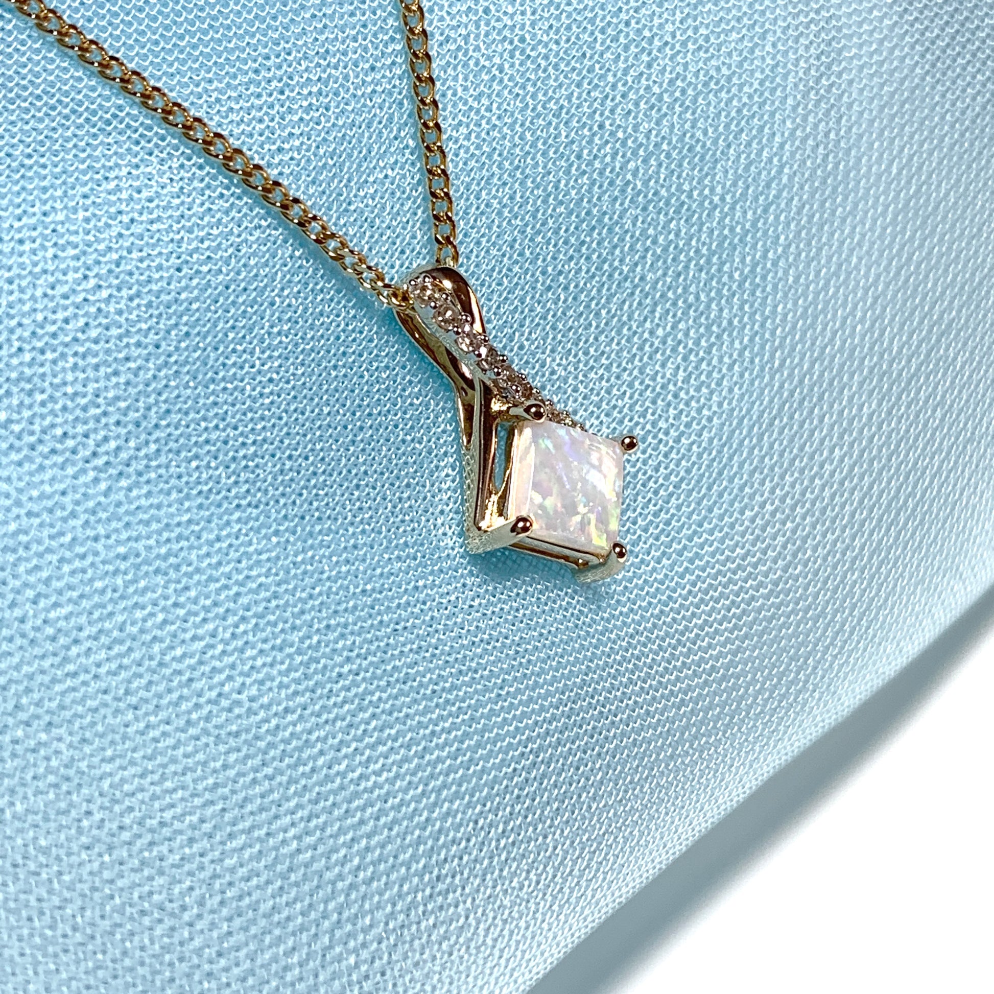 Gold opal and diamond necklace pendent