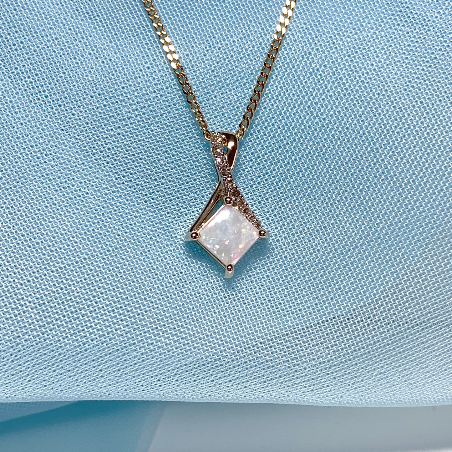 Gold opal and diamond necklace pendent