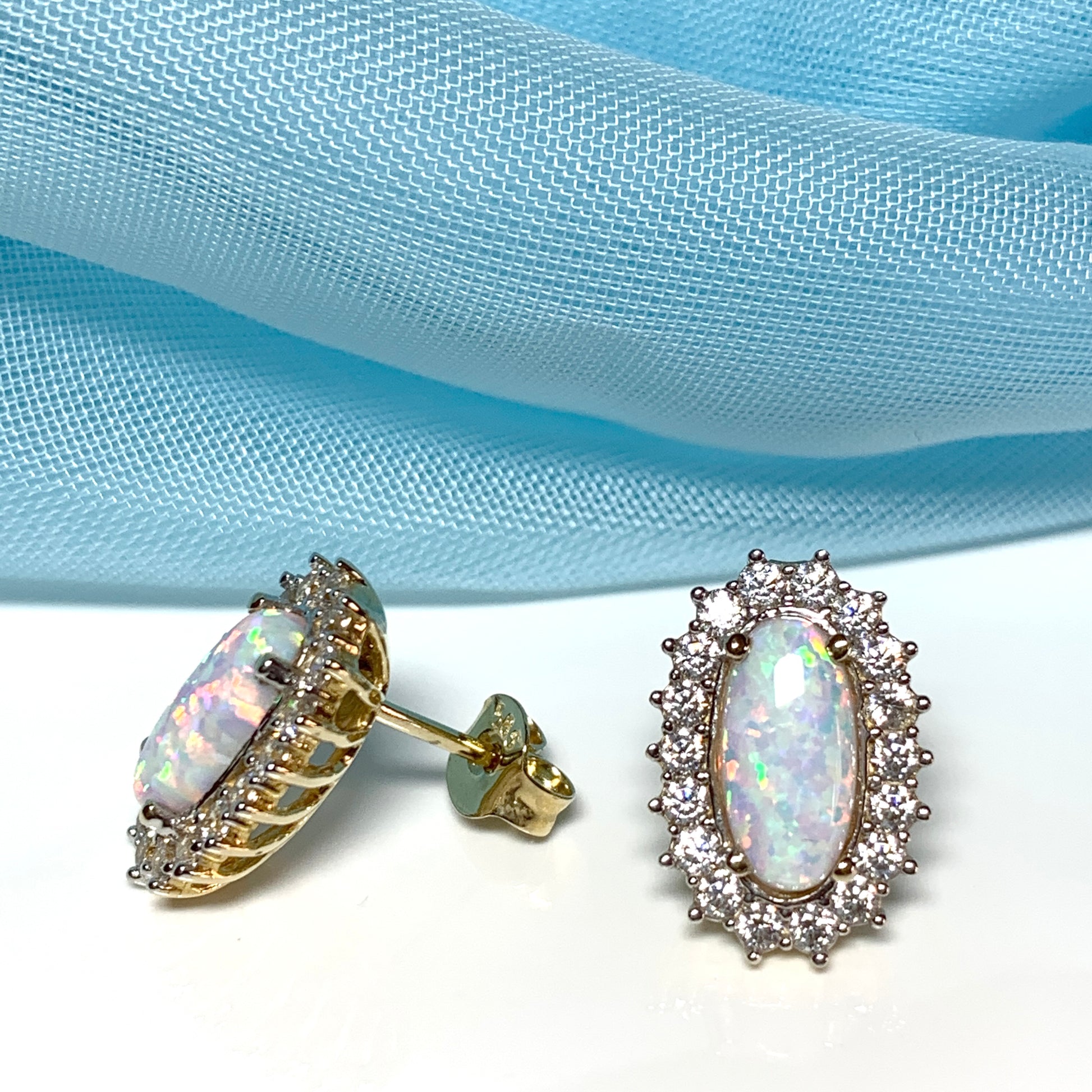 Gold oval opal and cubic zirconia earrings