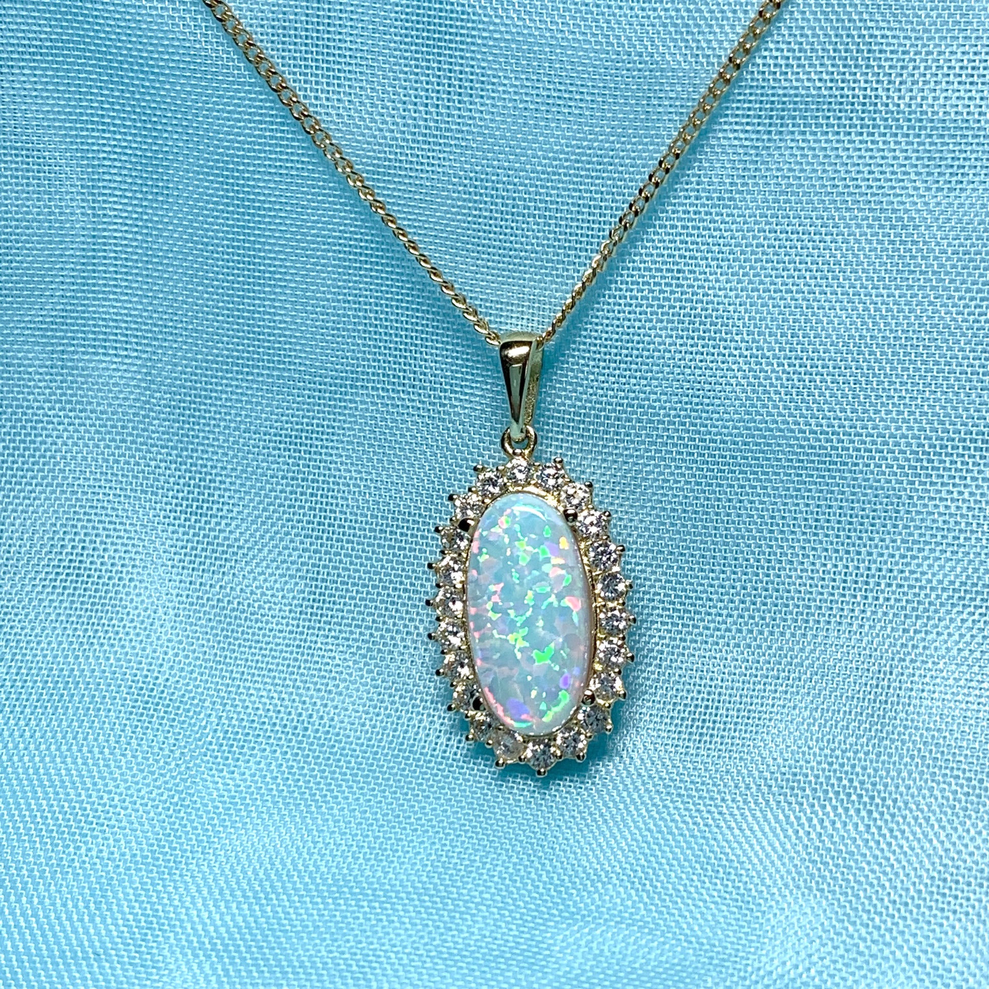 Gold oval opal and cubic zirconia necklace pendent