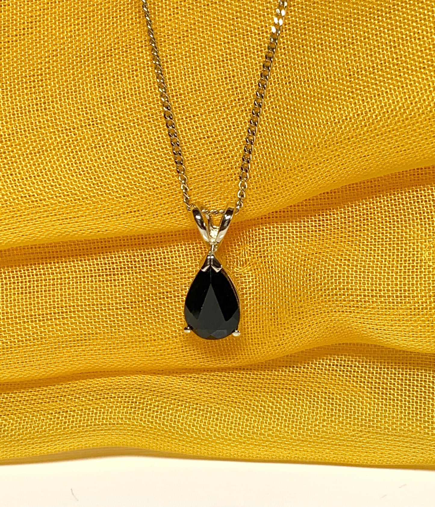 Yellow gold sapphire pear shaped necklace pendant