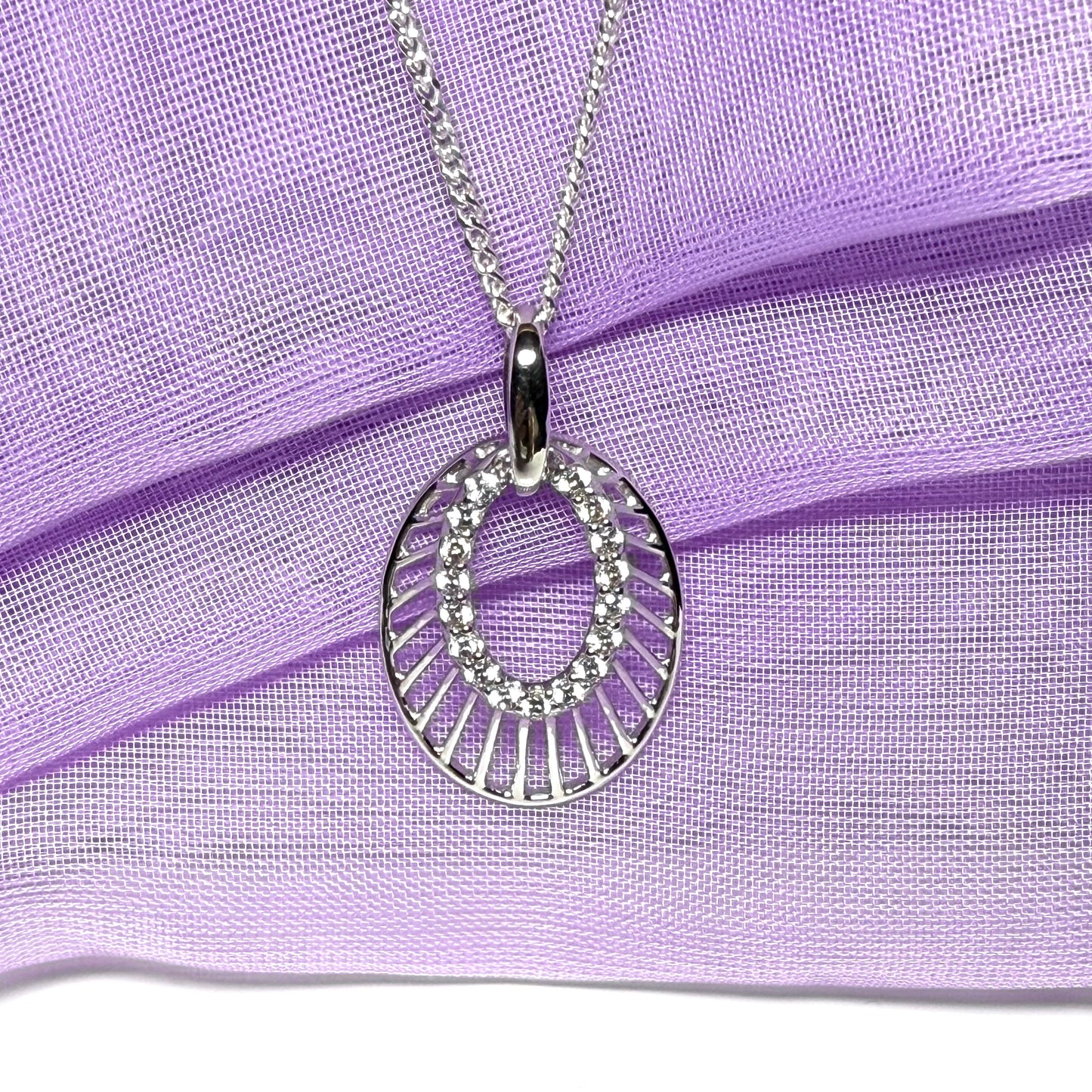 Oval shaped cubic zirconia sterling silver necklace with a chain