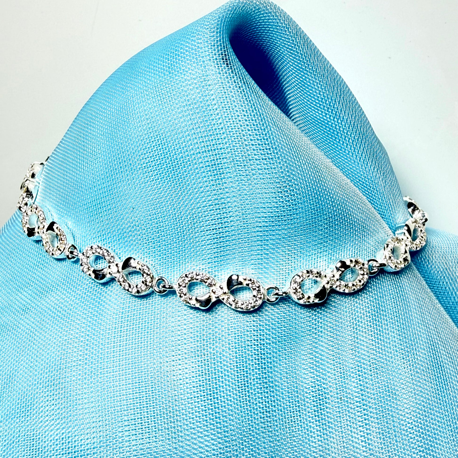 Sparkling infinity style shaped cubic zirconia sterling silver bracelet