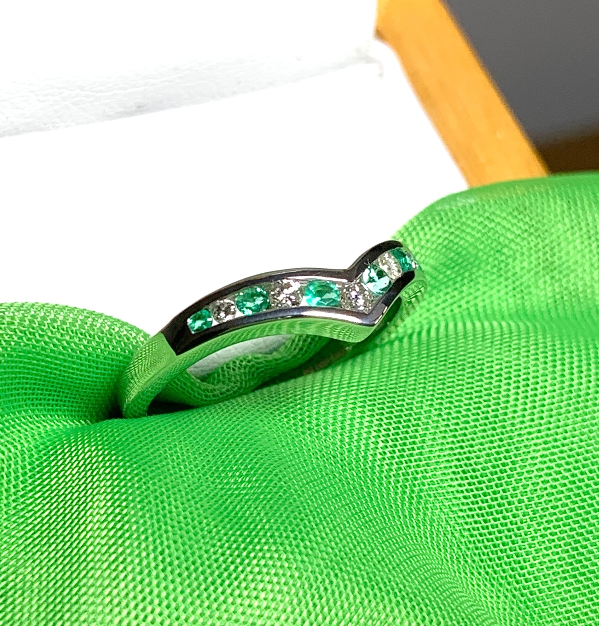 Green Emerald And Diamond White Gold Wishbone Ring Rubbed Smooth Over Setting