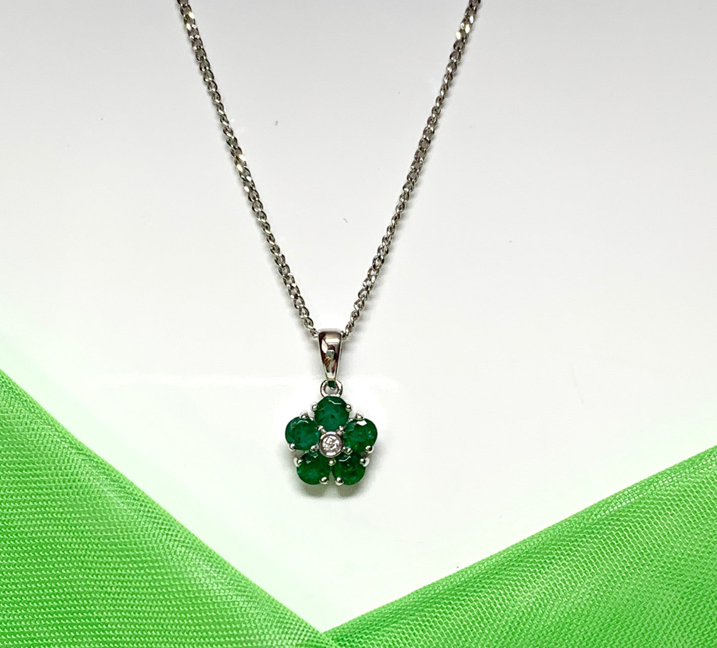Green emerald and diamond white gold daisy cluster necklace