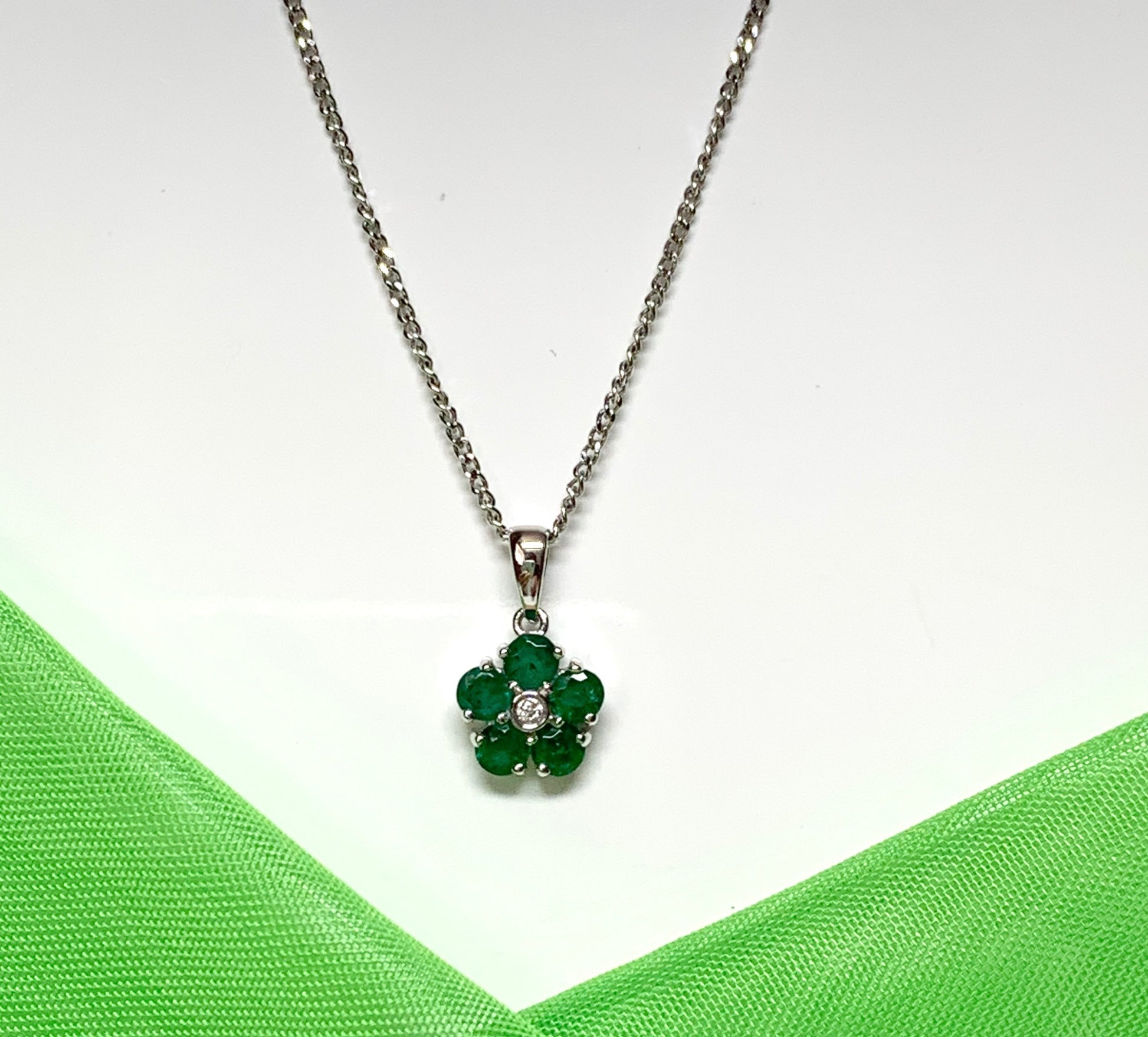 Green emerald and diamond white gold daisy cluster necklace