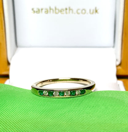 Green real emerald and diamond yellow gold channel set eternity ring