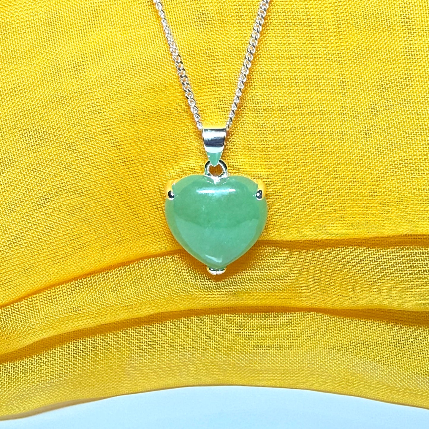 Heart shaped real green jade necklace with a claw set pendant and chain, simply gorgeous