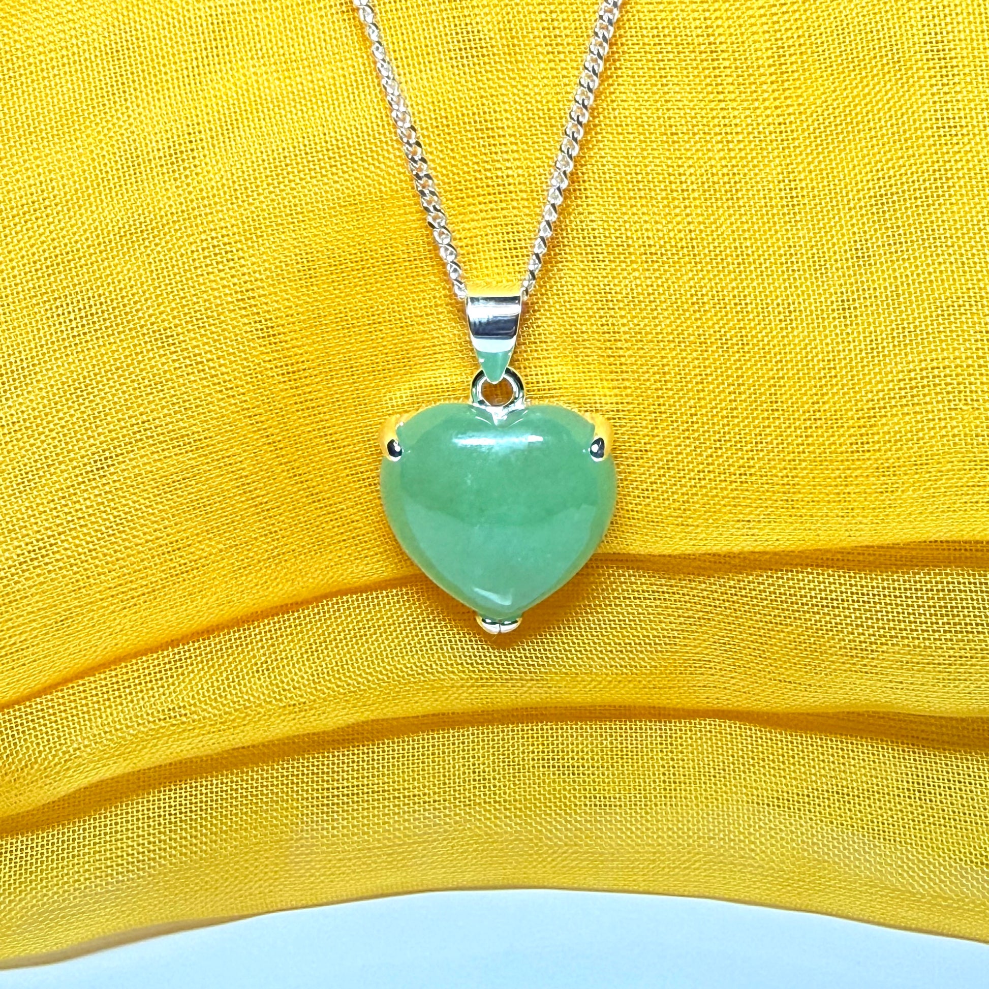 Heart shaped real green jade necklace with a claw set pendant and chain, simply gorgeous