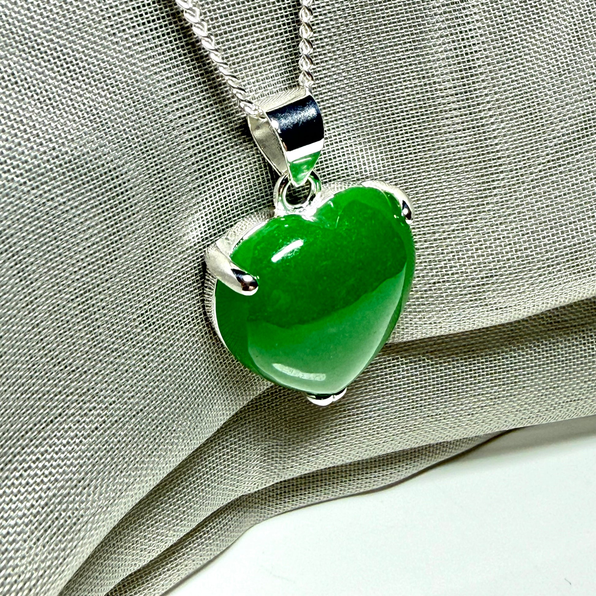 Heart shaped real green jade necklace with a claw set pendant and chain