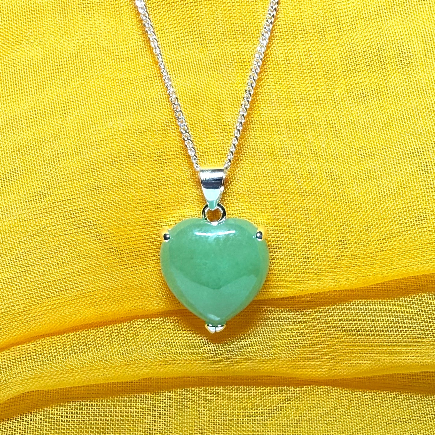 Heart shaped real green jade necklace with a claw set pendant and chain, simply gorgeous