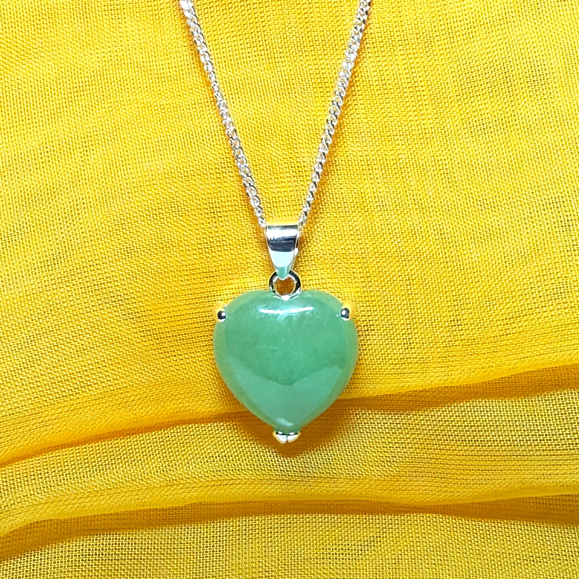 Heart shaped real green jade necklace with a claw set pendant and chain, simply gorgeous
