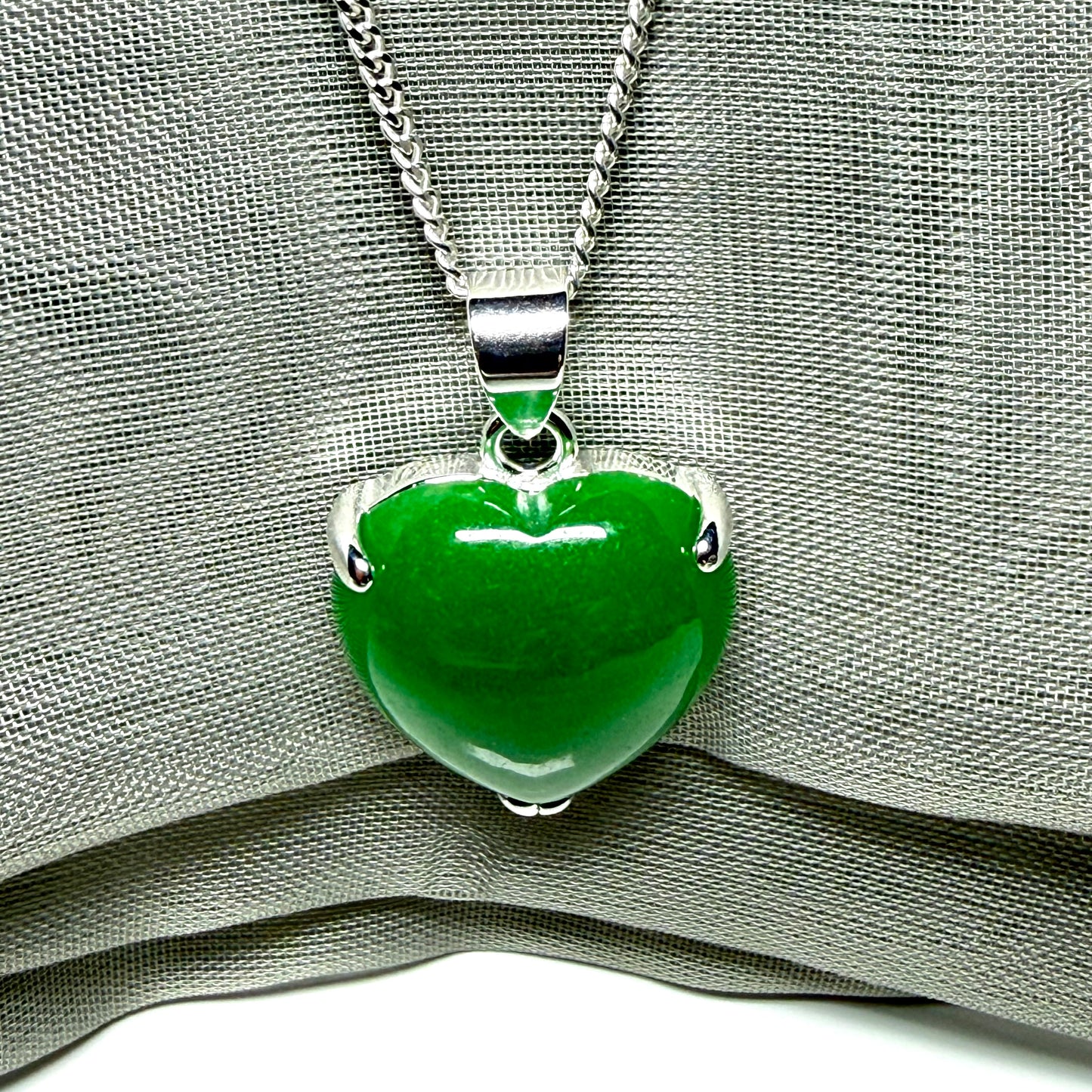 Heart shaped real green jade necklace with a claw set pendant and chain