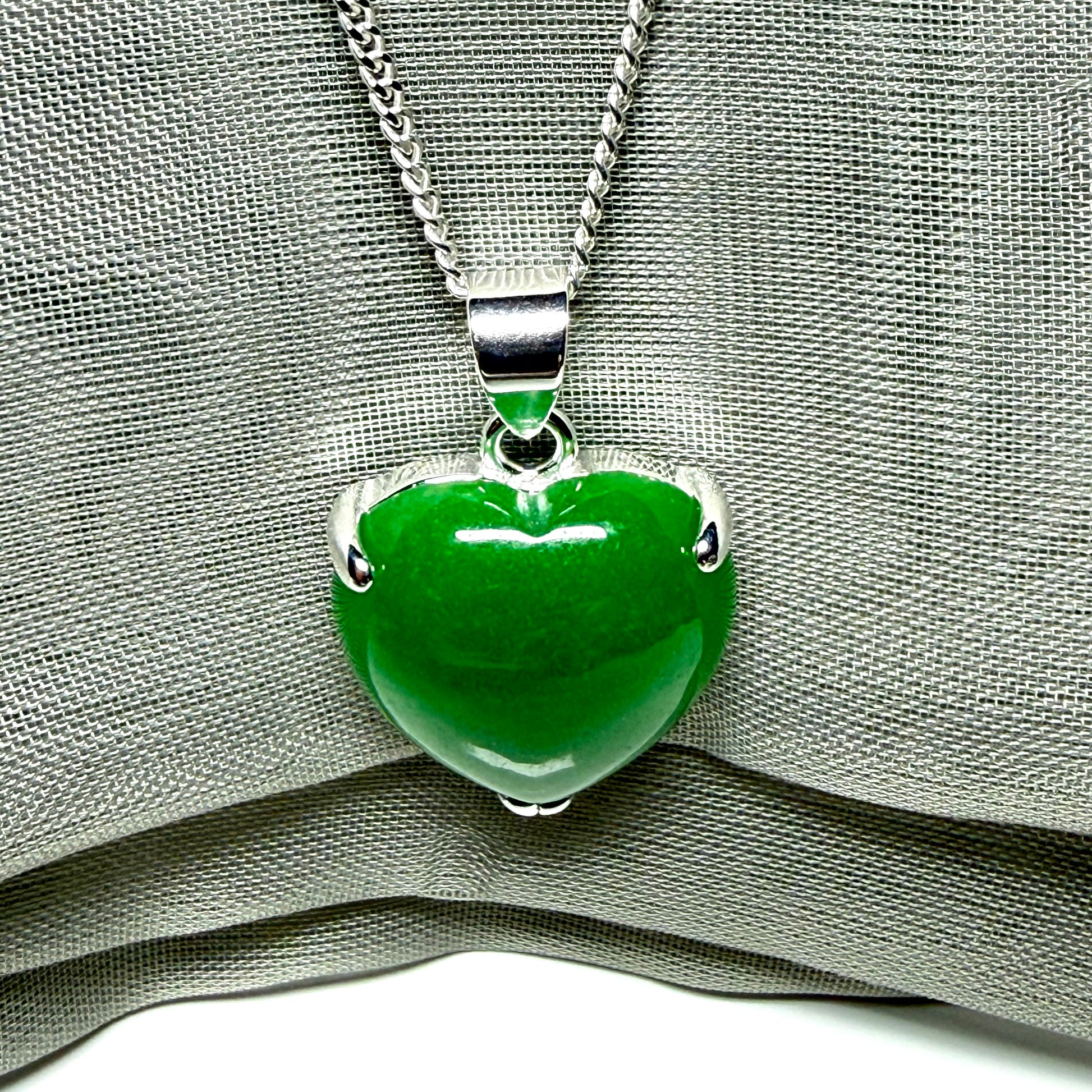 Heart shaped real green jade necklace with a claw set pendant and chain