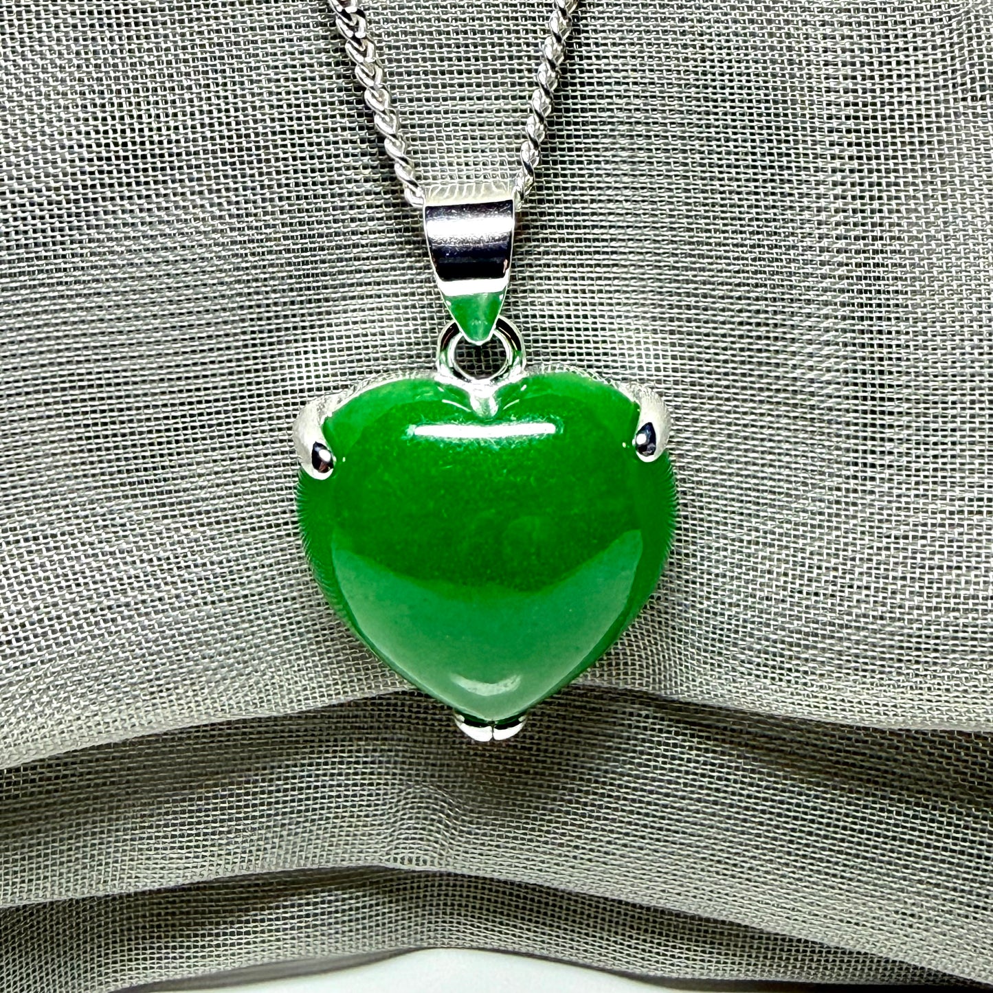 Heart shaped real green jade necklace with a claw set pendant and chain