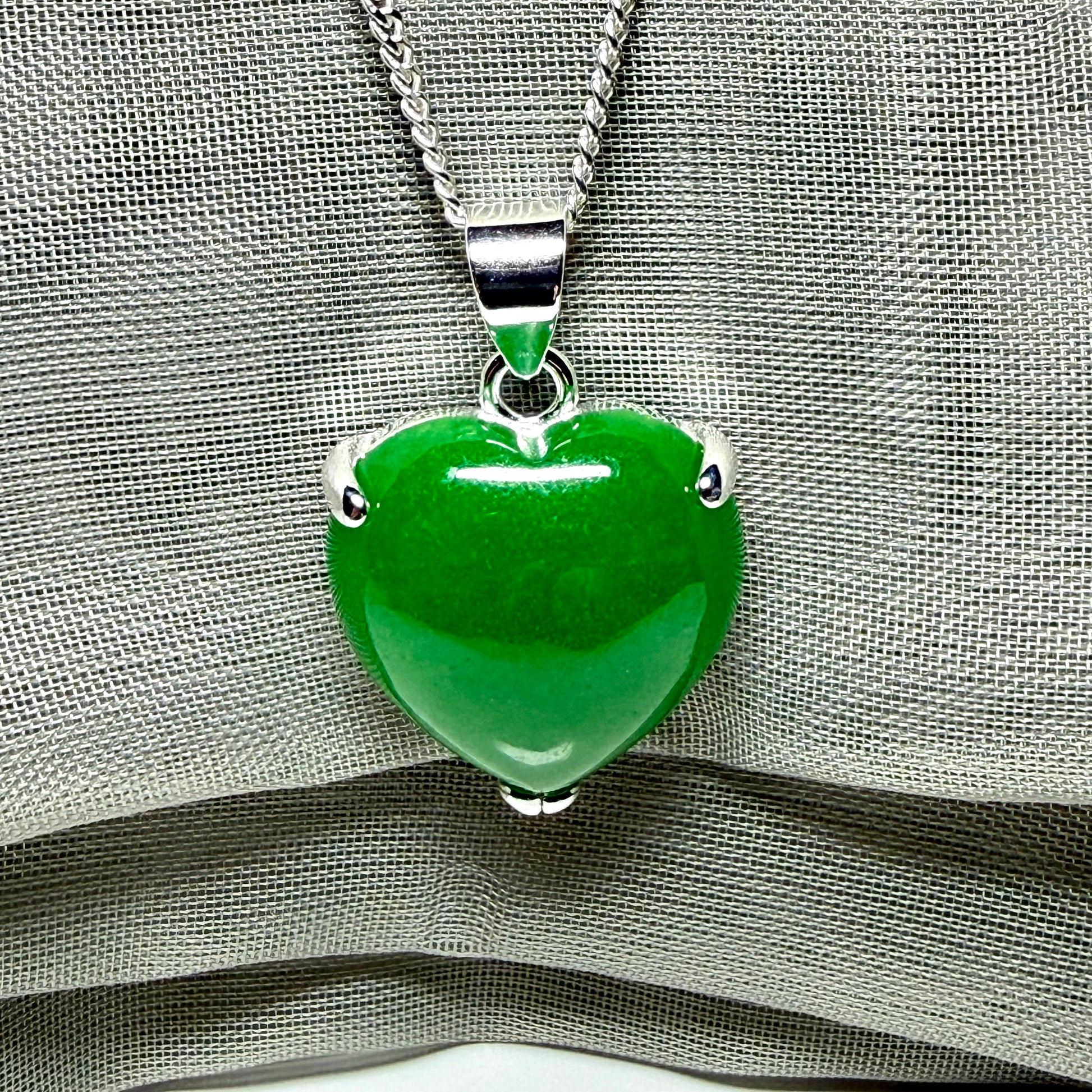 Heart shaped real green jade necklace with a claw set pendant and chain