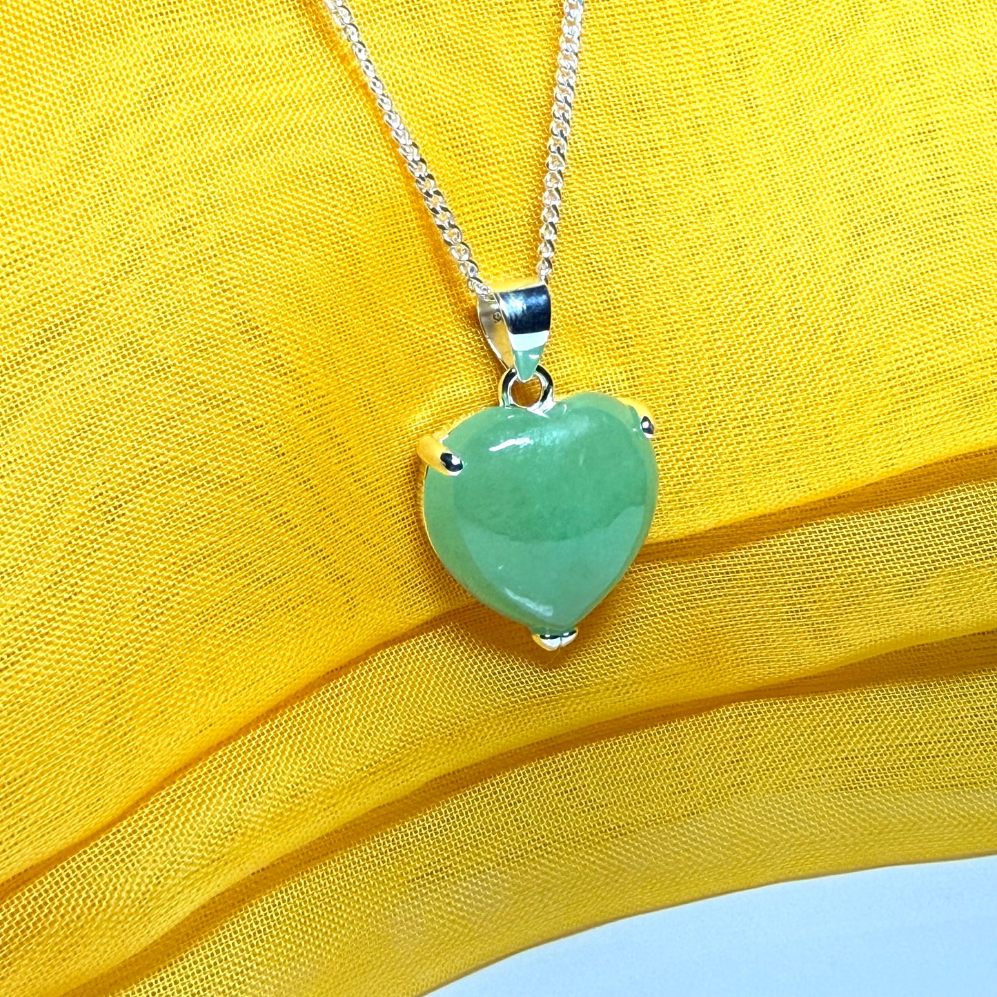 Heart shaped real green jade necklace with a claw set pendant and chain, simply gorgeous