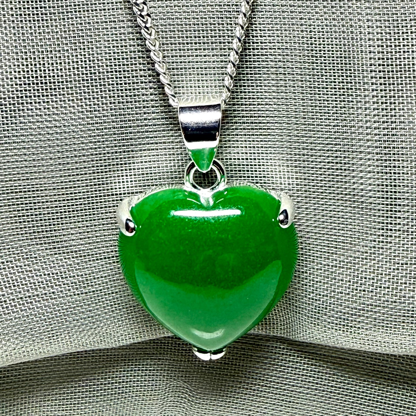 Heart shaped real green jade necklace with a claw set pendant and chain