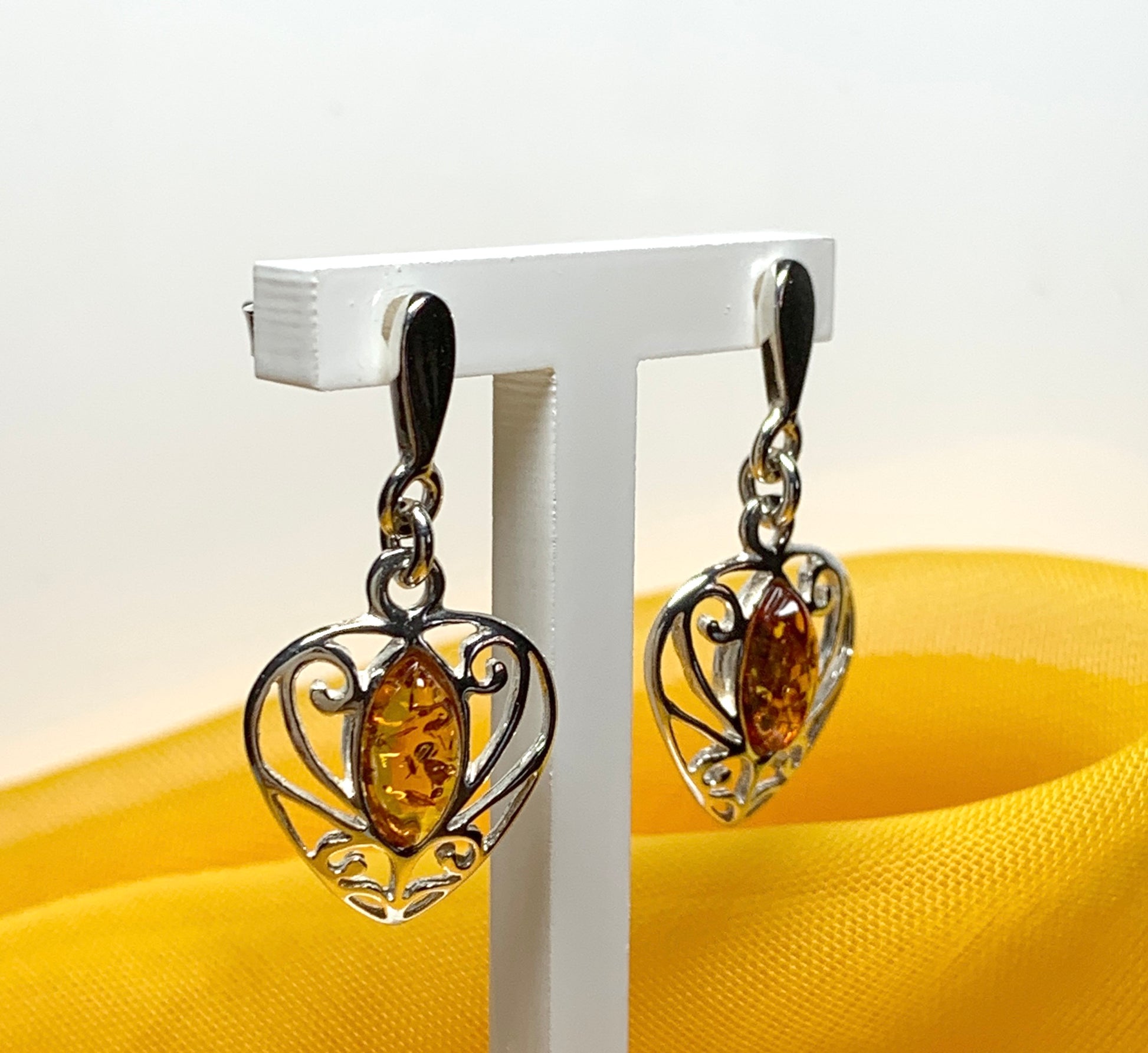 Heart shaped real amber drop earrings made in sterling silver