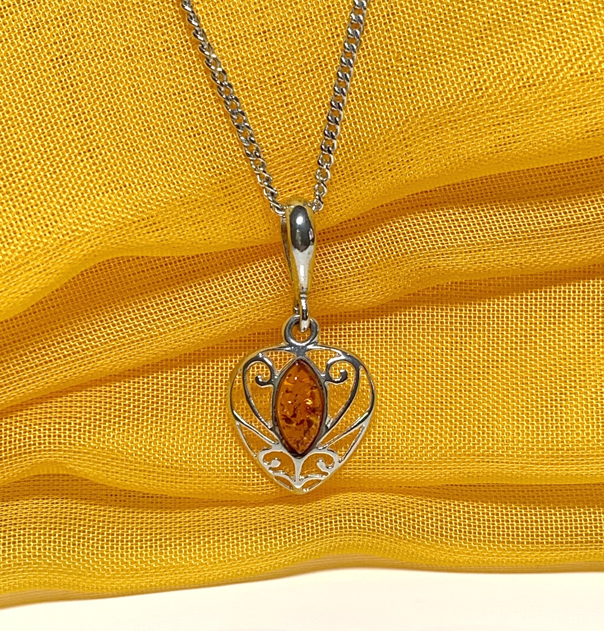 Heart shaped real amber necklace sterling silver pendant