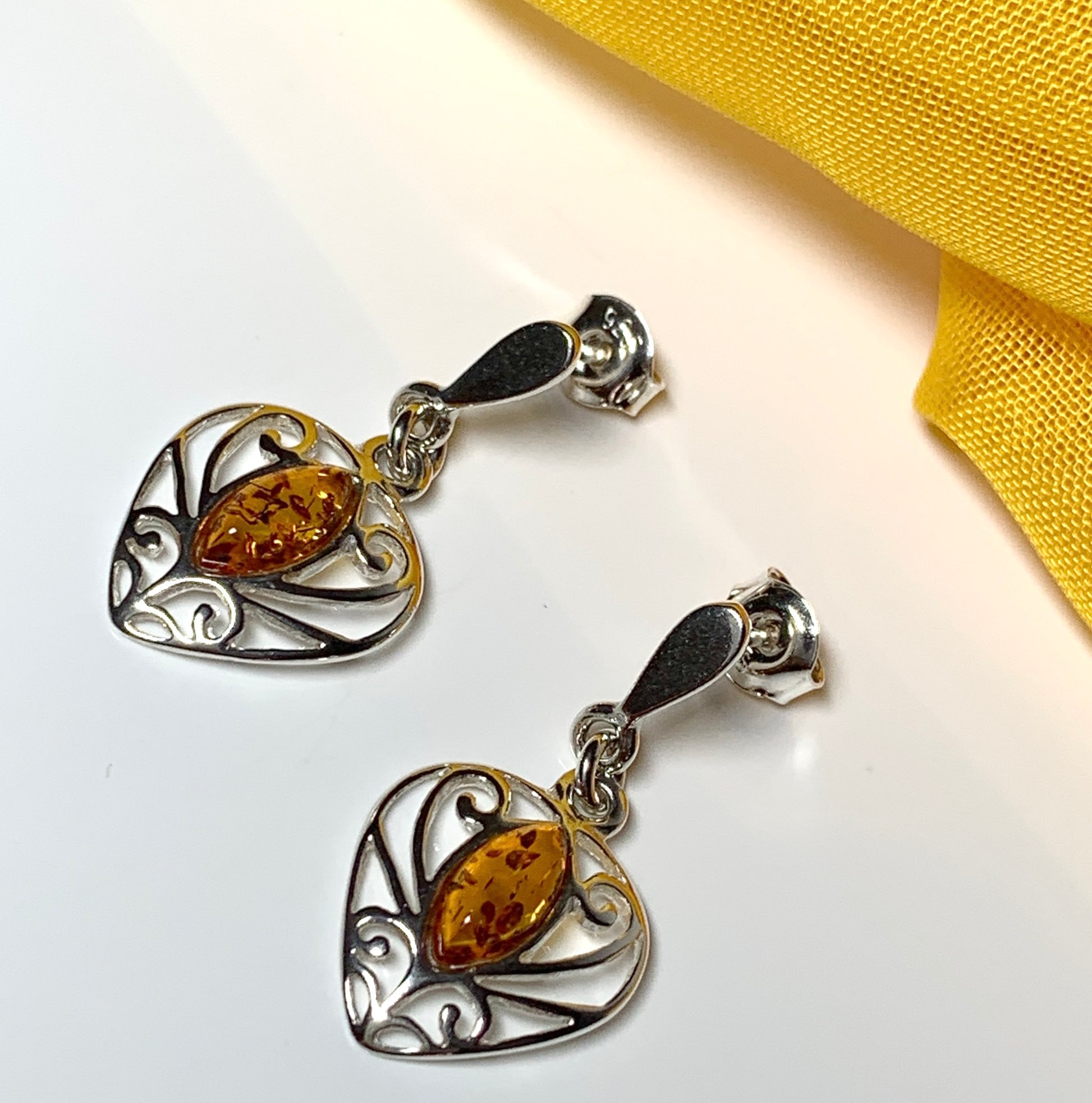 Heart shaped real amber drop earrings made in sterling silver