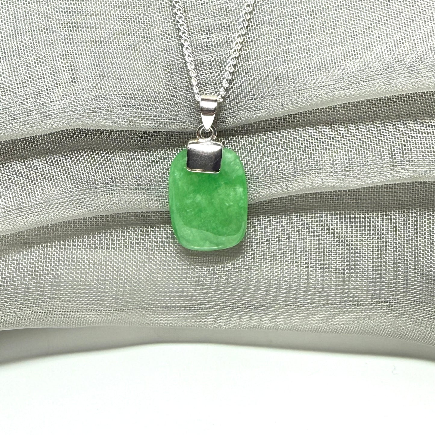 Real green jade necklace cushion shaped silver with a chain, a truly stunning pendant