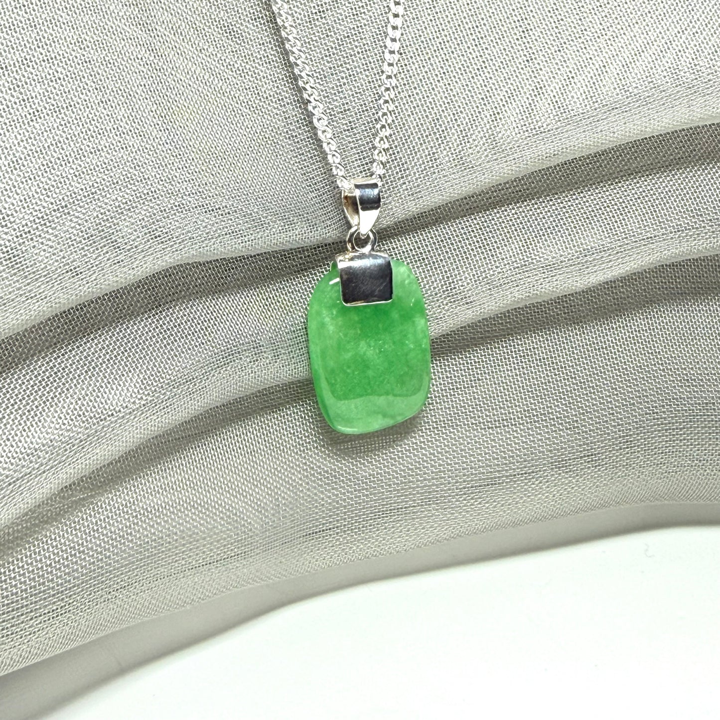 Real green jade necklace cushion shaped silver with a chain, a truly stunning pendant
