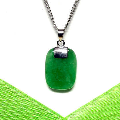 A necklace pendant having a real green jade sterling silver cushion shaped