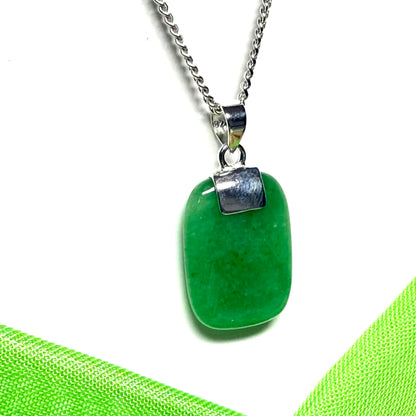 A necklace pendant having a real green jade sterling silver cushion shaped