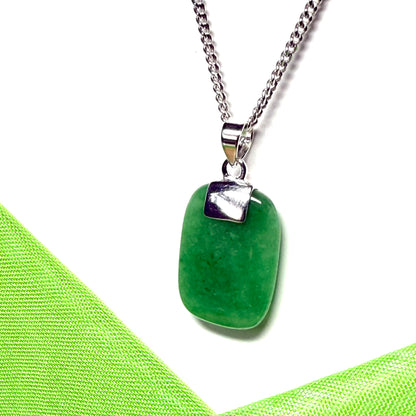 A necklace pendant having a real green jade sterling silver cushion shaped