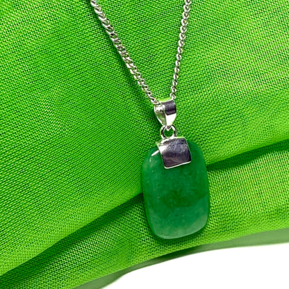 A necklace pendant having a real green jade sterling silver cushion shaped