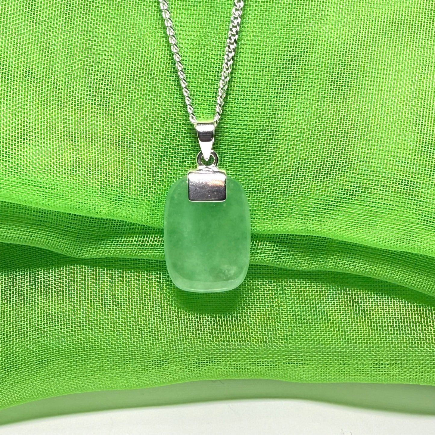 Real green jade necklace cushion shape stone sterling silver, a traditional designed pendant