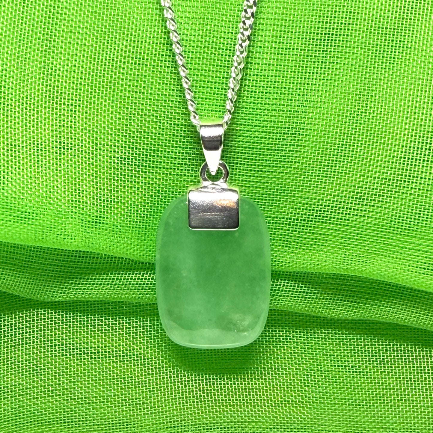 Real green jade necklace cushion shape stone sterling silver, a traditional designed pendant