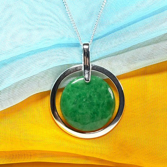 A large gorgeous sterling silver green real jade necklace halo style round pendant