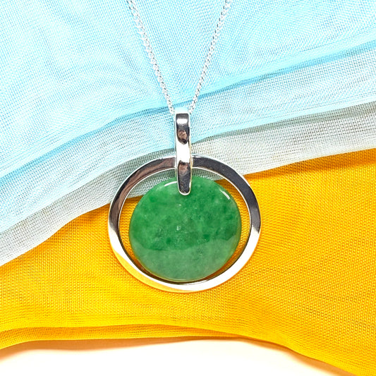 A large gorgeous sterling silver green real jade necklace halo style round pendant