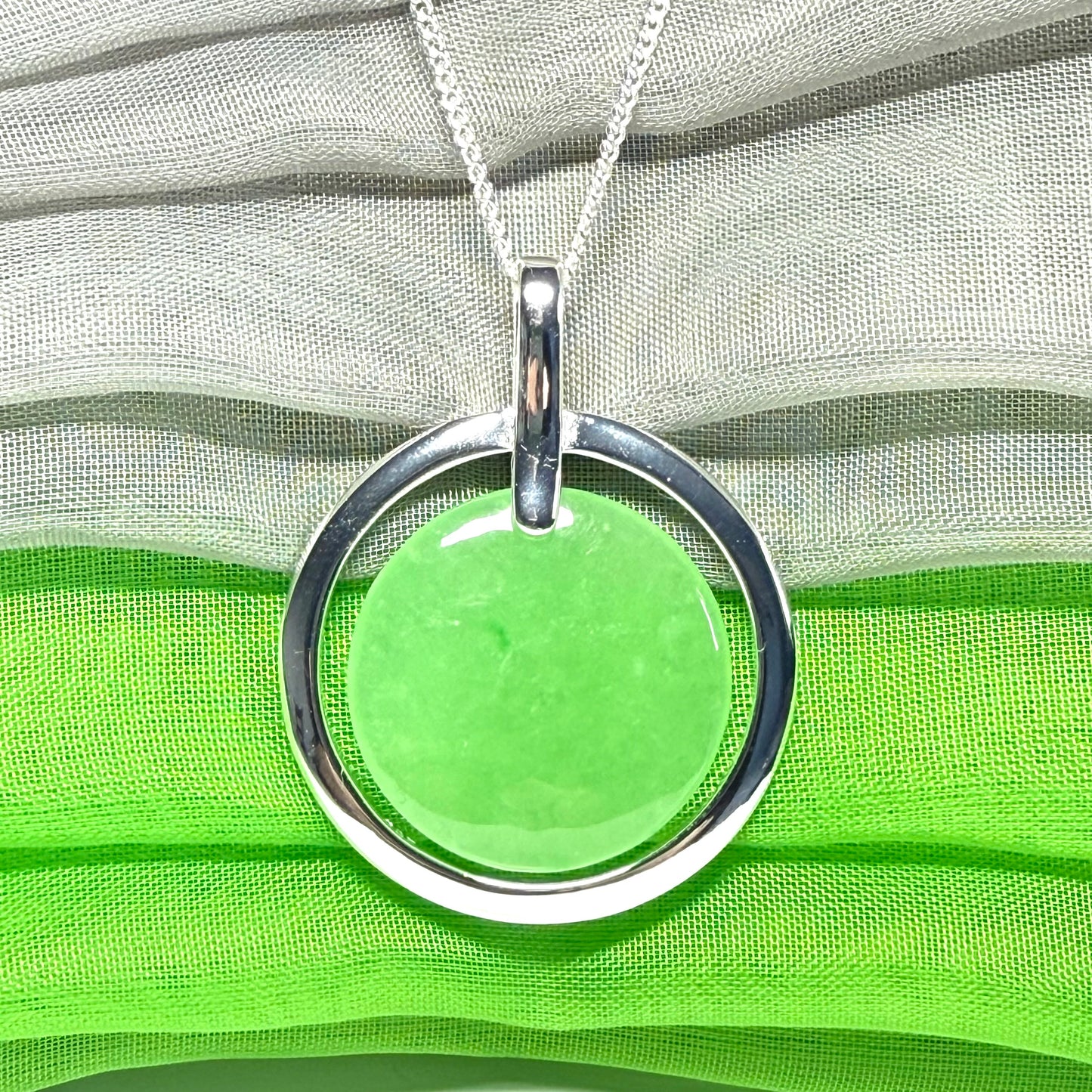 A large stunning sterling silver green real jade necklace halo style, a gorgeous designed round pendant