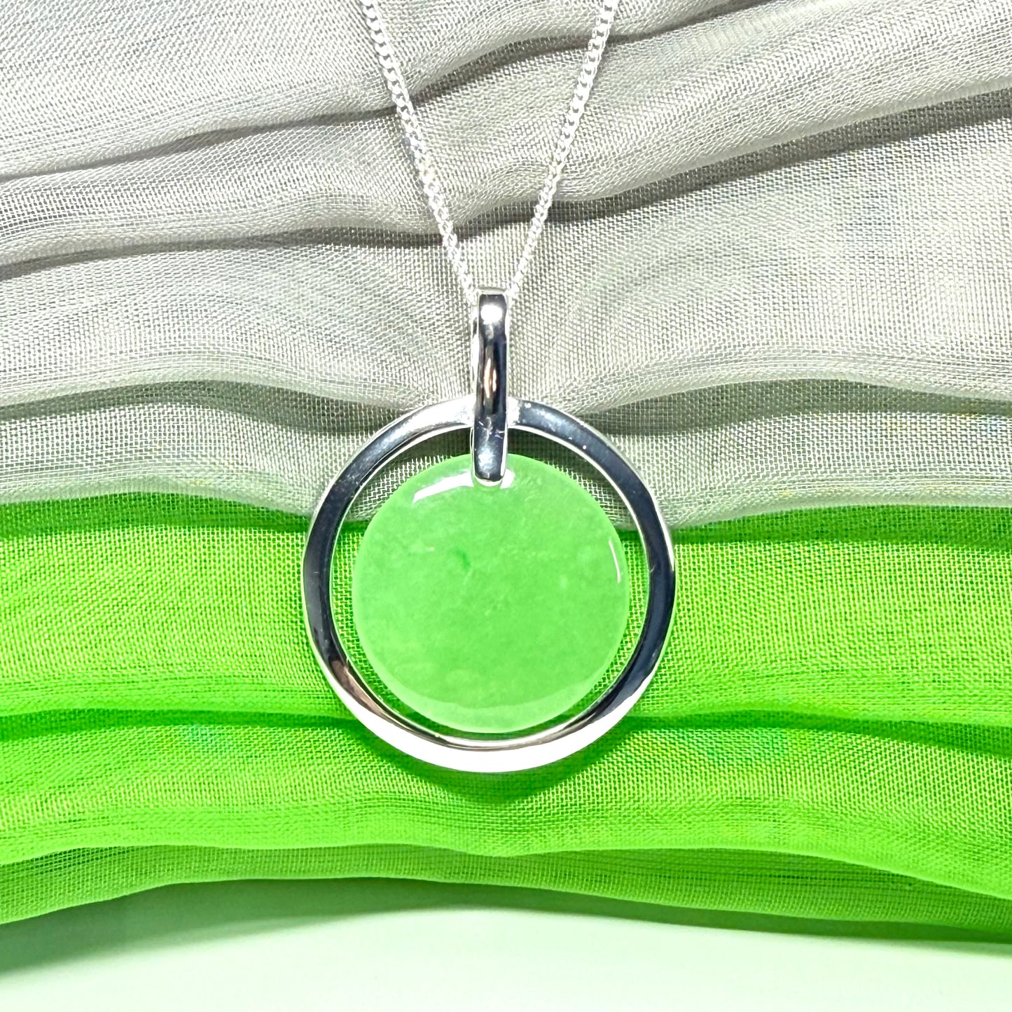 A large stunning sterling silver green real jade necklace halo style, a gorgeous designed round pendant