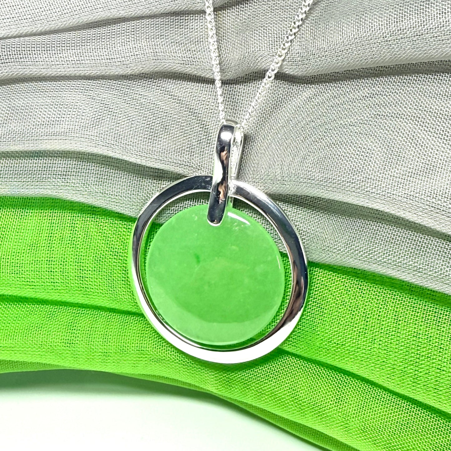 A large stunning sterling silver green real jade necklace halo style, a gorgeous designed round pendant