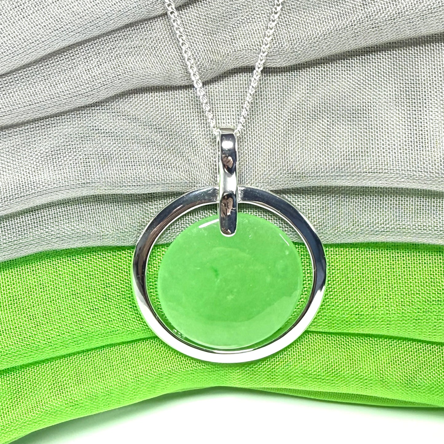 A large stunning sterling silver green real jade necklace halo style, a gorgeous designed round pendant